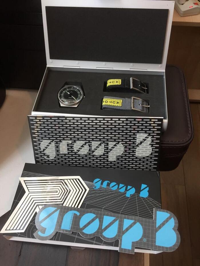 Contents of the case, including stickers with the logos of Autodromo and the Group B series.