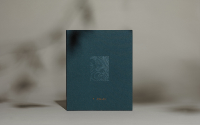 Front cover with bronze foil and white emboss.