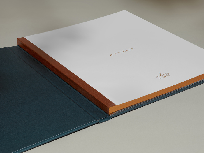Inside front cover. Swiss bound with bronze tape and bronze edging.