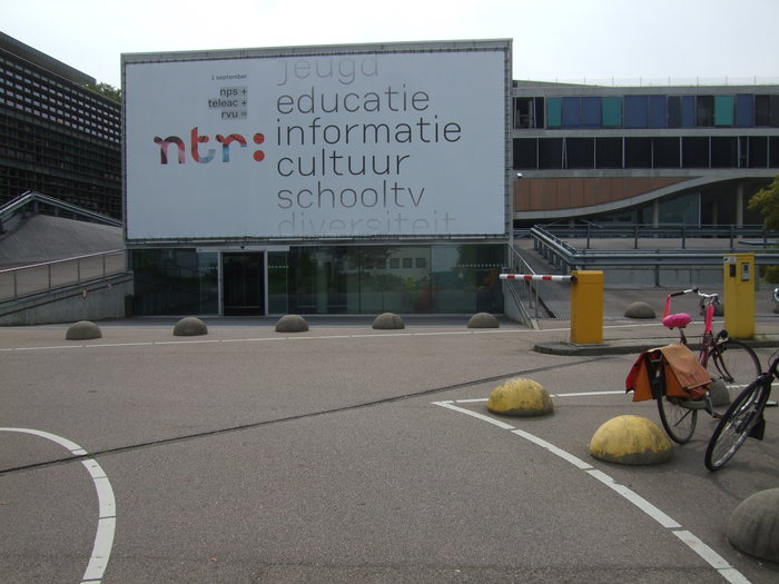 The NTR building in Hilversum in 2010, with a banner announcing the new station and its key topics (youth, education, information, culture, school TV, diversity).