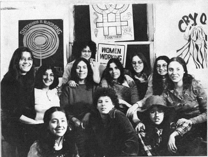 The Chicago Women's Graphics Collective in 1972, with a &ldquo;Sisterhood is Blooming&rdquo; poster in the background.