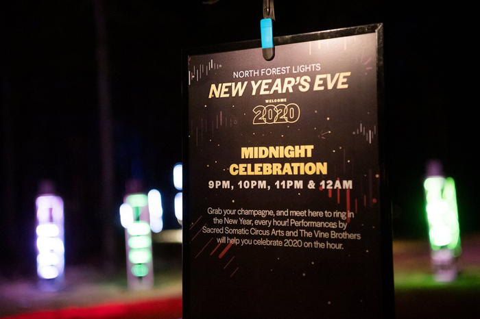 Poster for the New Year’s Eve party, featuring outlined and overlapping lining numerals from Halyard Display Black for “2020”.