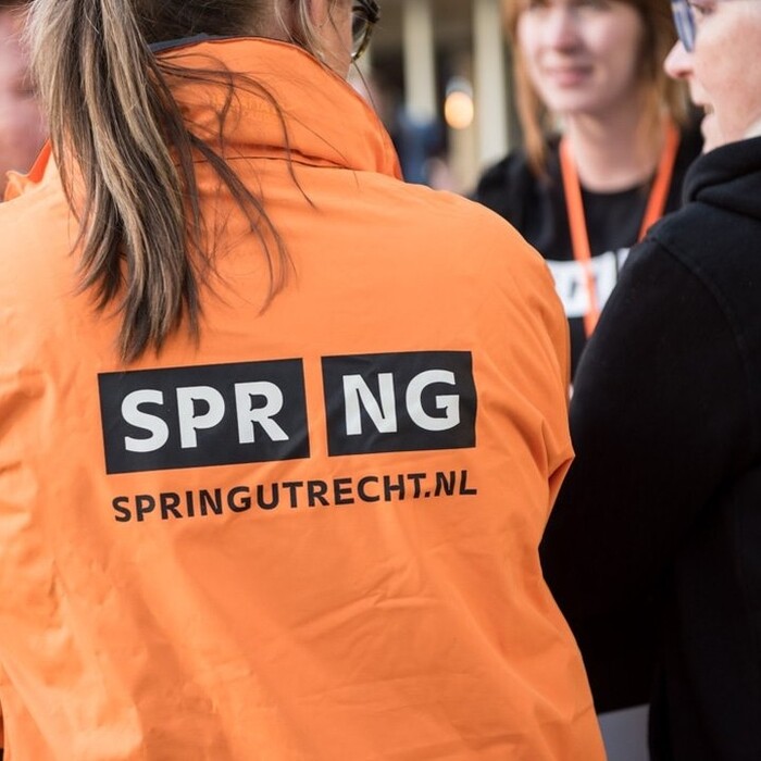Staff vests with the logo and the URL.