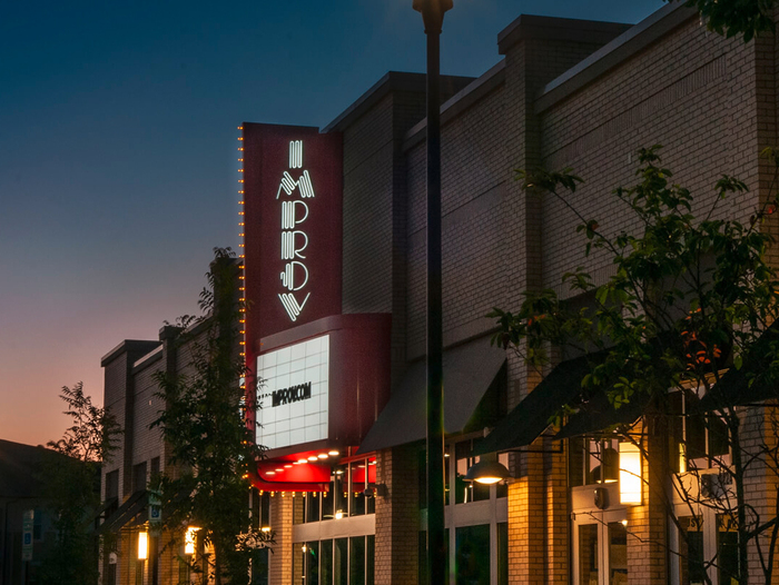 A vertical variant of the logo for the Improv in Raleigh.