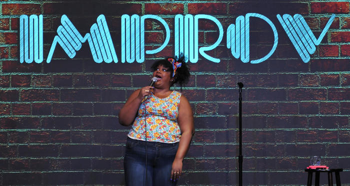 Nicole Byer on stage at the Improv in Raleigh.