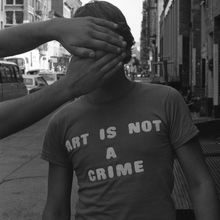 “Art Is Not A Crime” shirt in <cite>Style Wars</cite> (1983)