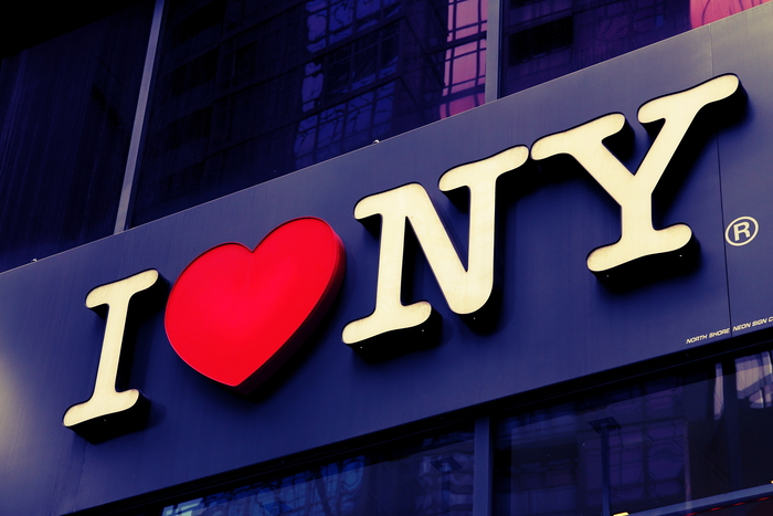 “I ❤️ NY” as illuminated sign on a shop front, NYC, 2013.