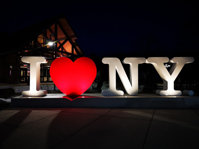 Three-dimensional version of the logo (with straightened letter shapes) in Pine Valley, Moreau, New York, 2020.