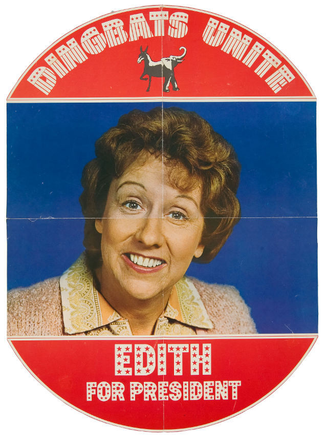 17×23″ poster with full color portrait of Jean Stapleton surrounded by her Edith Bunker campaign slogan “Dingbats Unite – Edith for President” and a janiform bipartisan donkeyphant. The typography uses two faces from Photo-Lettering’s patriotic department,  and .
