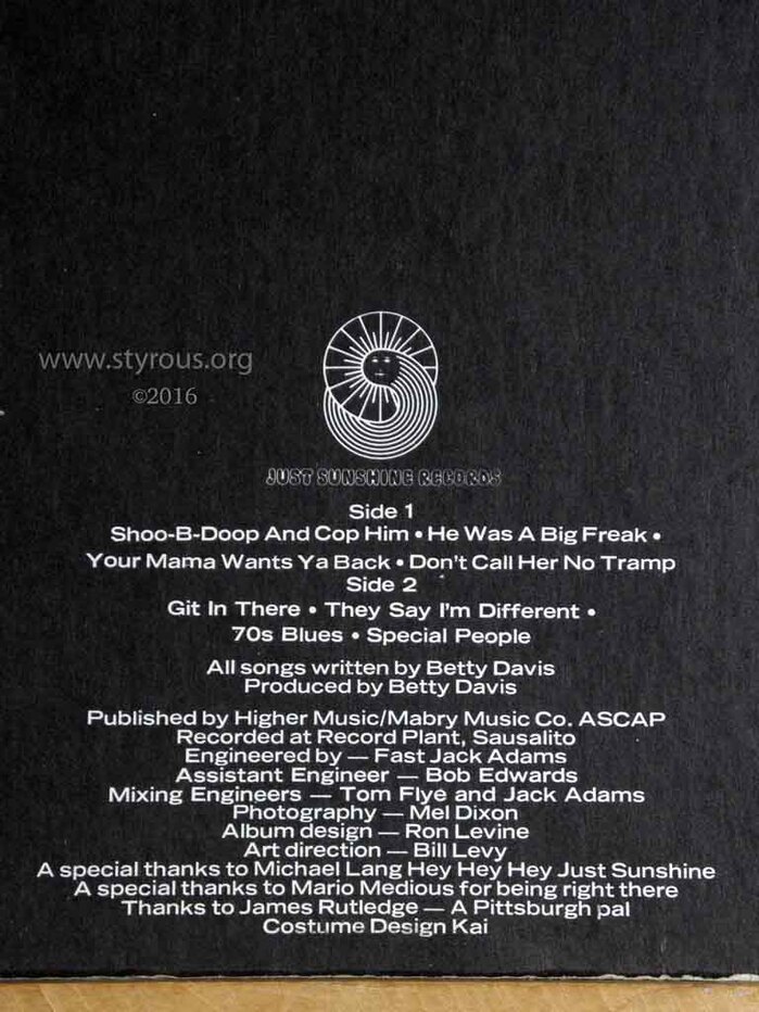 Center-aligned credits in  Bold Extended, from the inner gatefold