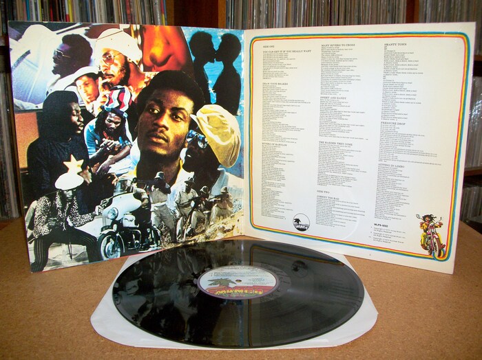 Inner gatefold with a collage of photos and lyrics.