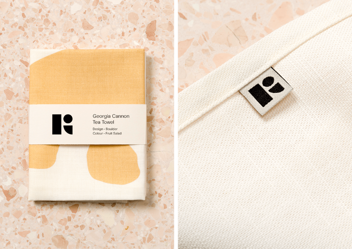 Tea towel packaging and logo mark detail.