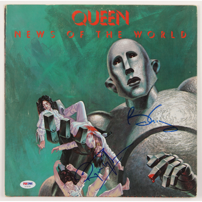 Front cover signed by Brian May and Roger Taylor.