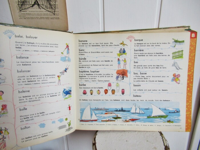 The book’s interior is set in various sans serifs: Headwords appear to be in  (or a similar typeface?). The example sentences are set in two weights of , while the conjugated forms and the captions feature several styles from .