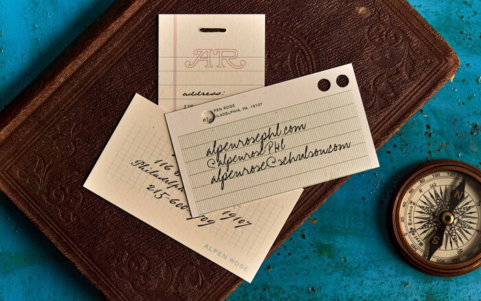 The handwriting fonts on these address cards are (from top to bottom of the stack): , , . The shaded caps for “Alpen Rose” are from .