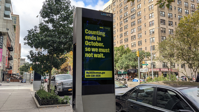 A LinkNYC kiosk with messaging in English