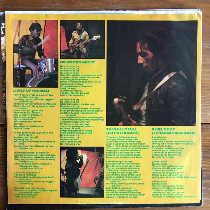 Inner sleeve with lyrics in colored Gill Sans Bold.
