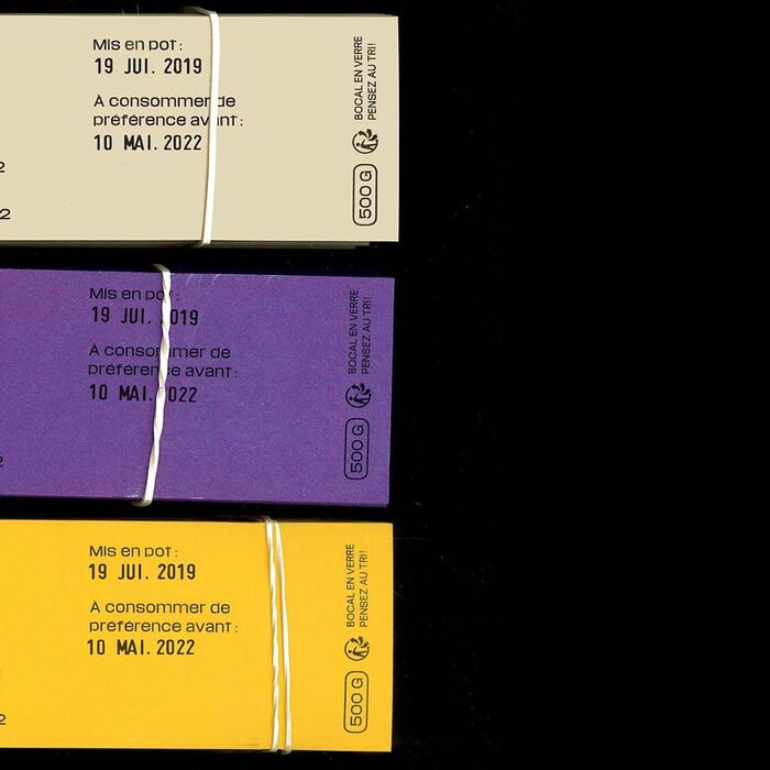 The packaging and best-before dates are added manually with stamps.