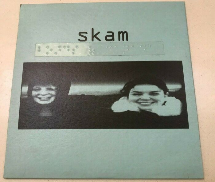 The back sleeve has a clear sticker affixed, with “Boards of Canada” in Braille.