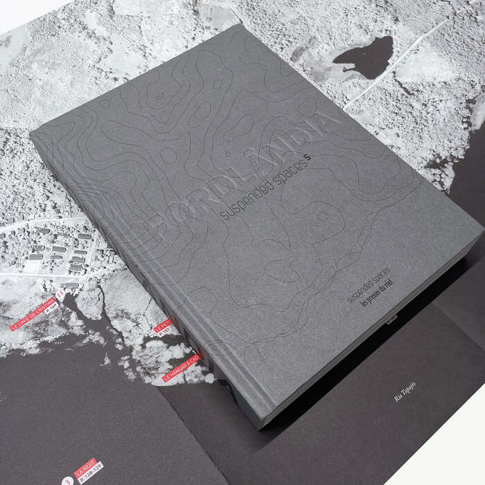 The book comes with a folded poster that serves both as a map and an index.