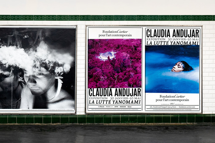 Exhibition posters in a Paris Métro station.