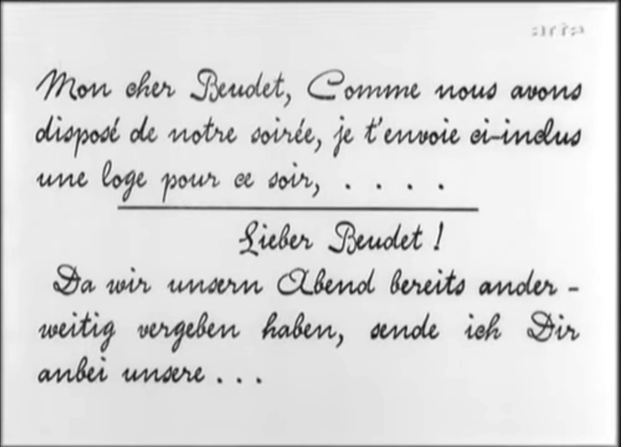 The text of a letter received by the husband is shown in (again bilingual) title cards, set in a script typeface that emulates handwriting.