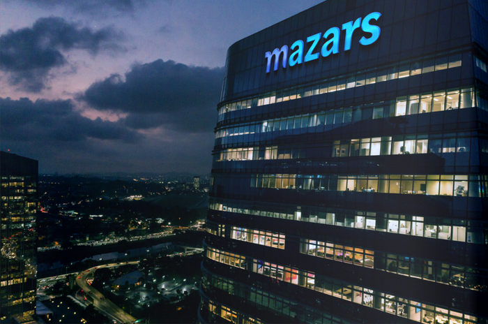 The new logo on the facade of a Mazars office building.