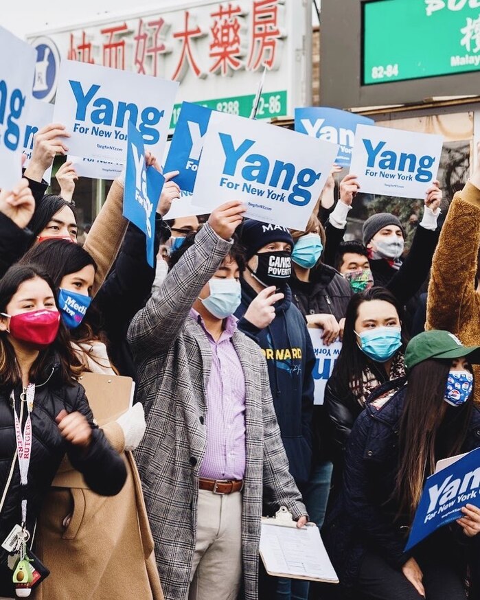 The Yang for New York logo as seen on paper signs at a rally.