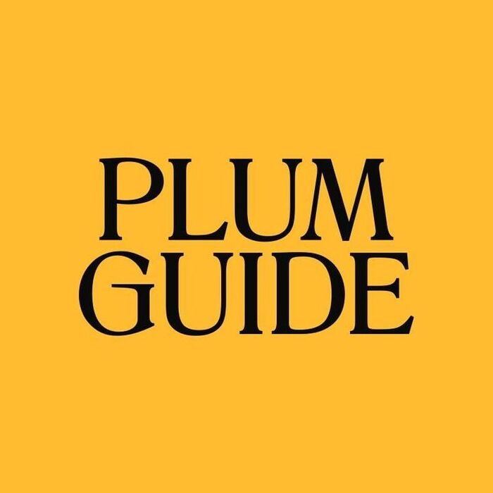 The Plum Guide logotype uses all-caps Romana, customized with an elongated G bar.