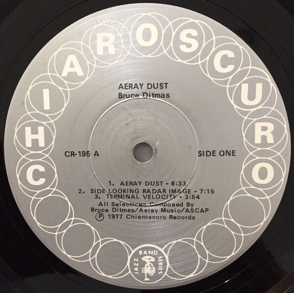 Aeray Dust record label (1977). Text is set in the IBM Selectric version of Univers. “Chiaroscuro” is in caps from Univers Bold.