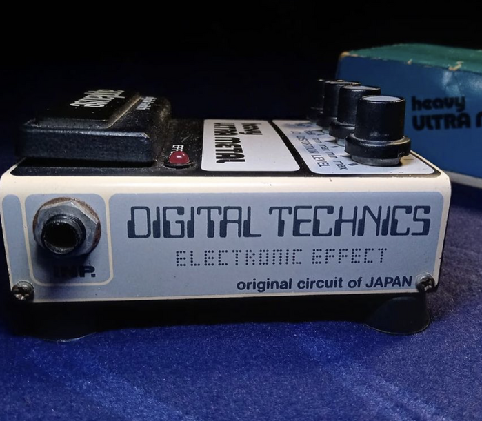 The -style caps for “Digital Technics” and the dot-matrix letters for “Electronic Effect” are unidentified. Regarding the former,  (2001) has a similar C, but is different in other details. Chances are it’s a custom-drawn logo.