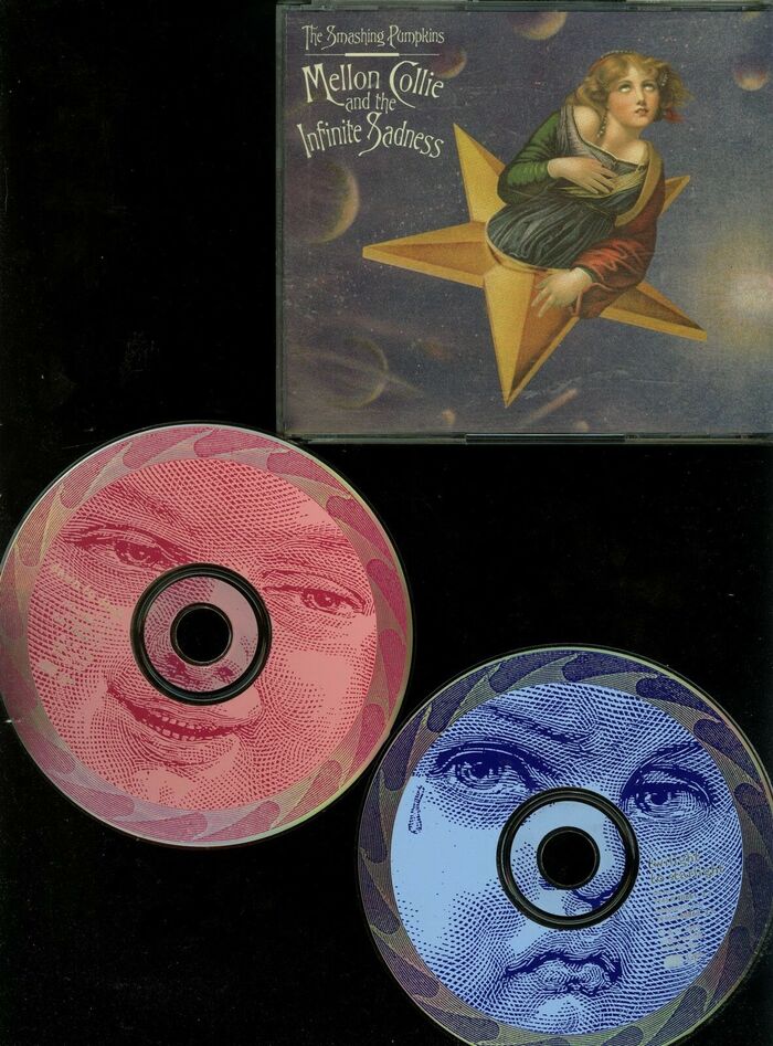 Front cover and tops of both CDs in the double CD album.