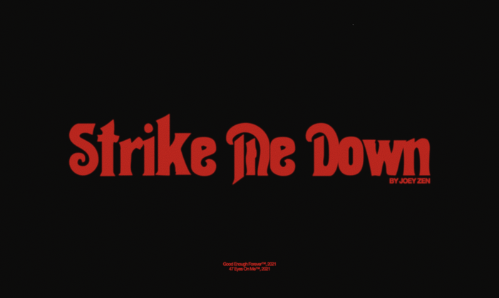 Official title card still from the “Strike Me Down” music video by Joey Zen. The title card uses Thalia for the main title. The credit underneath is set in Alte Haas Grotesk.