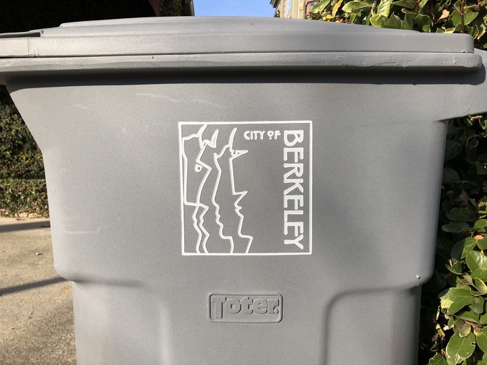 The logo in a routed rendition, as seen on a trash bin.