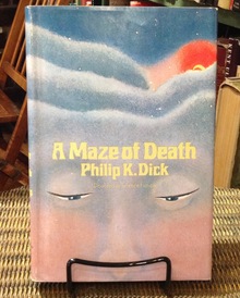 <cite>A Maze of Death</cite> by Philip K. Dick (Doubleday, 1970)