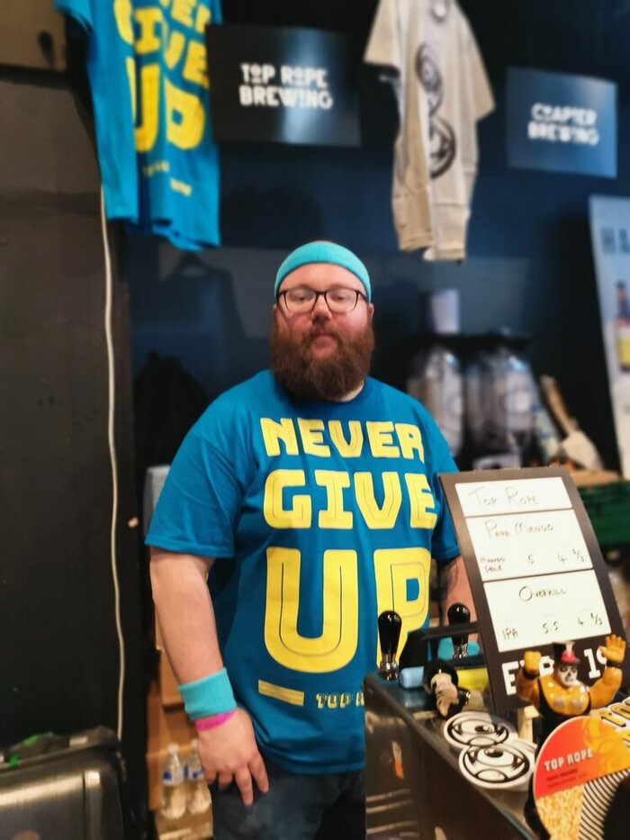 “Never Give Up” T-shirt.