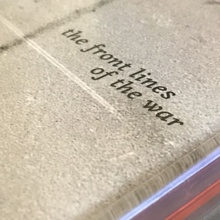 <cite>The Front Lines of the War</cite> album art