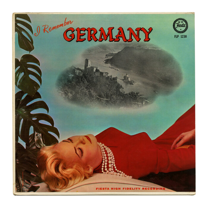 Vol. 1 features  with custom script lettering and a lady dreaming of Gutenfels Castle above the Rhine. The small type at the bottom is in red caps from  Wide. [More info on Discogs]