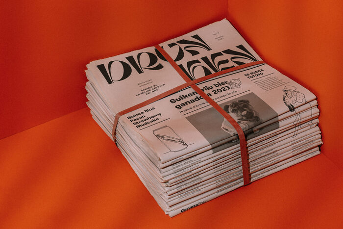 The Drunken newspaper combines a logo in  with text in .