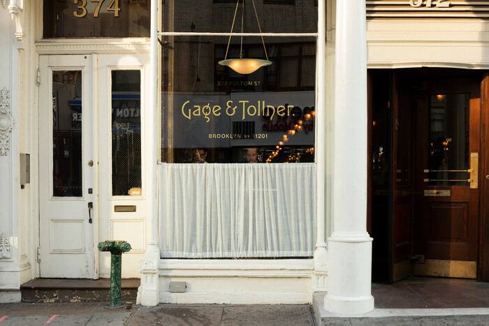 Travis Fitzsimmons of Travis Signs applied the logo to the restaurant window in gold leaf—see a time lapse here.