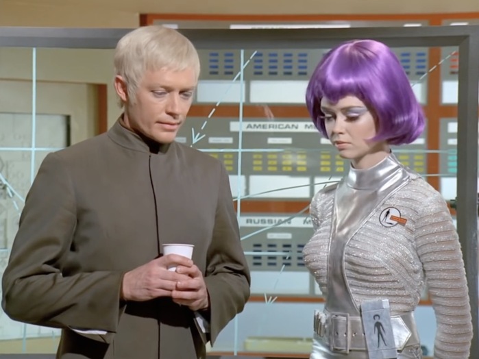 UFO: lead actors Ed Bishop and Gabrielle Drake, with Eurostile labels hiding behind futuristic outfits
