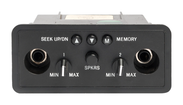 This control panel provided audio and headphone controls for second-row passengers in a Ford Aerostar van, 1989–1995. Note the distinctive K shape. The Ford part number E99Z-19A164-A dates this part to 1989.