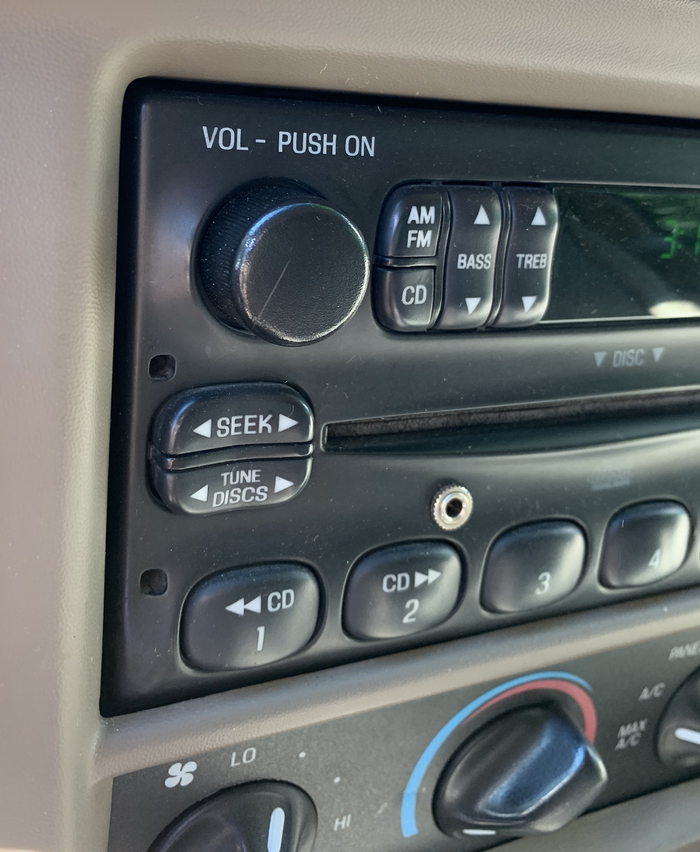Although designed in the 1990s, the Ford pickup’s relatively smooth shapes work well with the unique Modula lettering. Note the use of the groovy and distinctive letter K. The ‘surround’ shape of the radio’s main panel uses '“pad printing” for the lettering. The buttons are molded in white with black paint; the lettering is etched or laser-cut out of the paint.