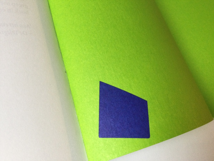 Part of fallen capital L on innerside cover next to last page