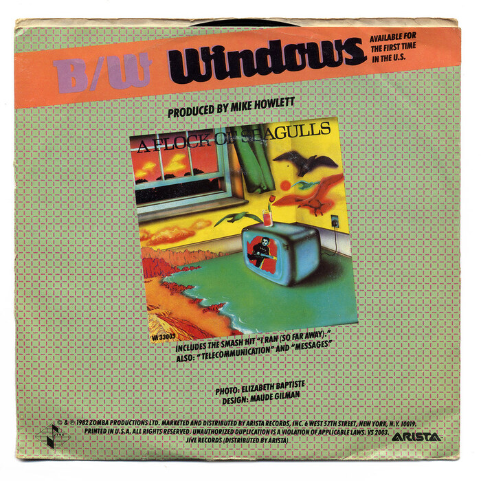 The back cover continues the “on an angle” theme. It depicts the LP cover and mentions the title of the B-side, “Windows”. Originally not on the album, this song was included on the remastered CD reissue from 2011. Small text is added in , in italic all caps.