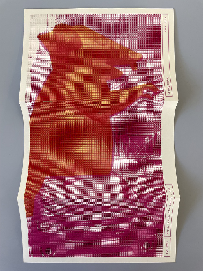 The cover folds out into a poster