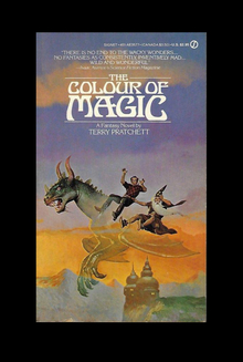 <cite>The Colour of Magic</cite> by Terry Pratchett (Signet, 1985)