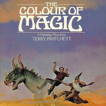 <cite>The Colour of Magic</cite> by Terry Pratchett (Signet, 1985)