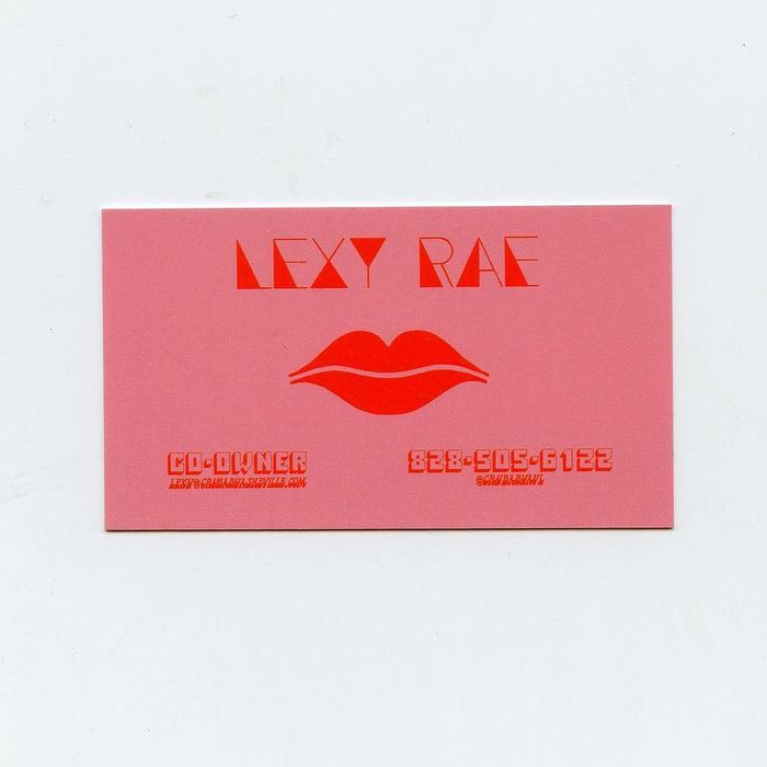 The back of the business card additionally features  (1970) for the title and phone number.