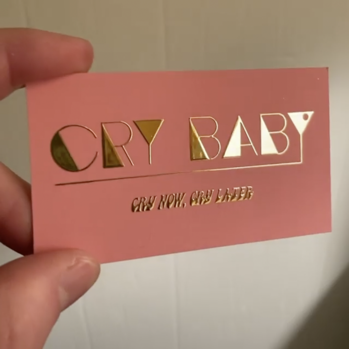 Business card featuring the logo in Ricky Tick, with  (2018) for the slogan, “Cry now, cry later”. See Connor’s video for full glory. He comments: “This is most likely the start of a long tradition of gold embossing everything.”